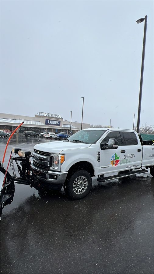 Ford Super Duty plow truck in falling snow