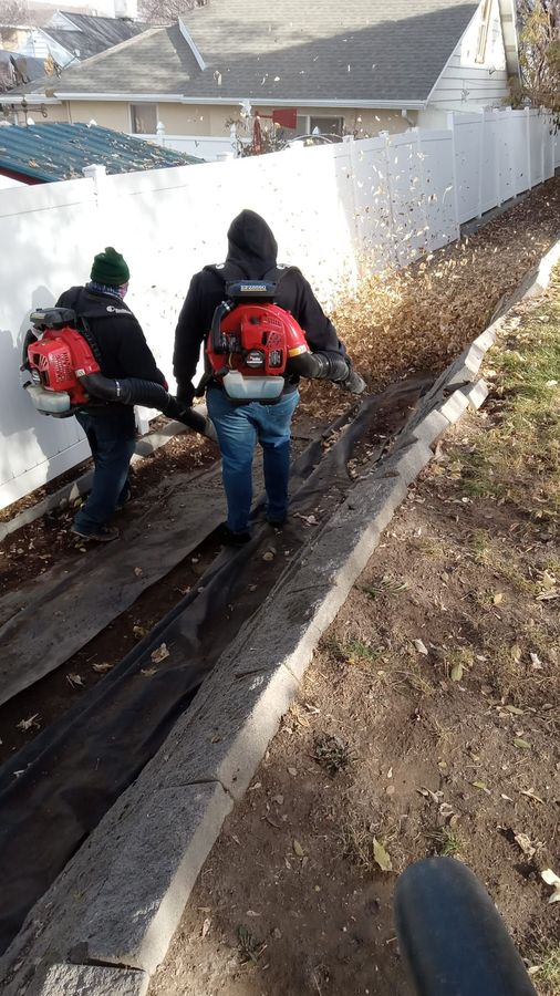 Crew blowing leaves during fall cleanup