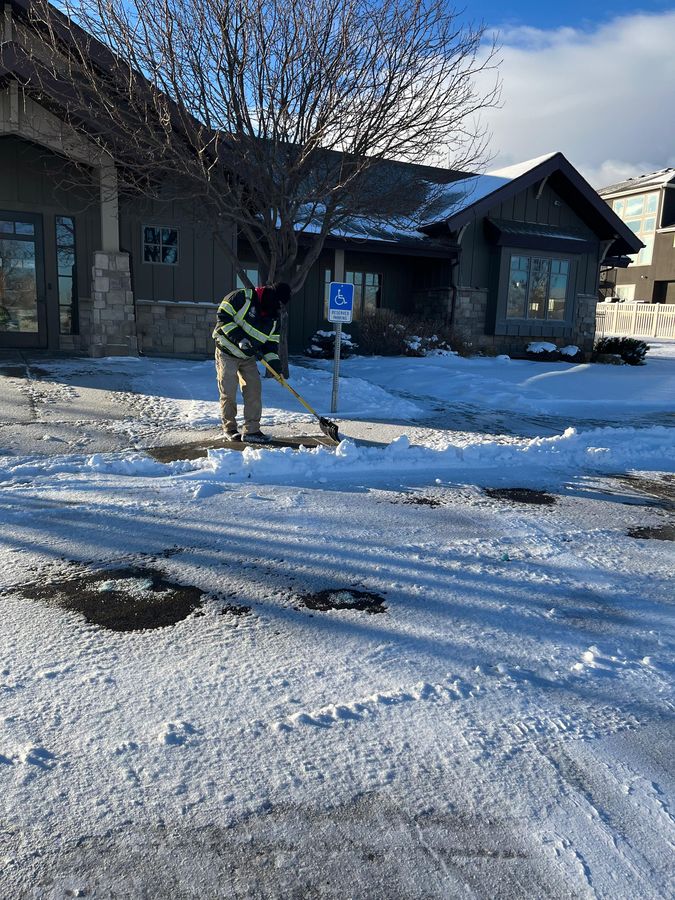 Shoveling an entryway clear of snow