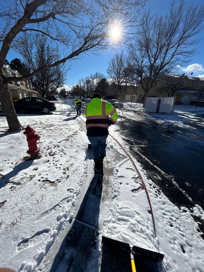 Crew clearing residential sidewalks