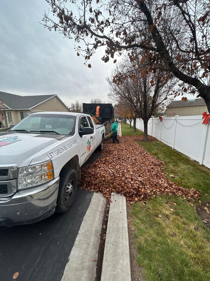 Vacuuming fall leaves into a truck loader